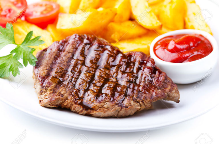 plate of grilled meat with vegetables